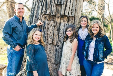 The real-life Beam family and their cottonwood tree - with the cross
